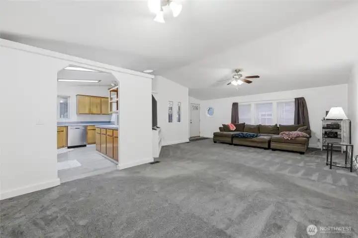 View of living room, kitchen and entry from dining area