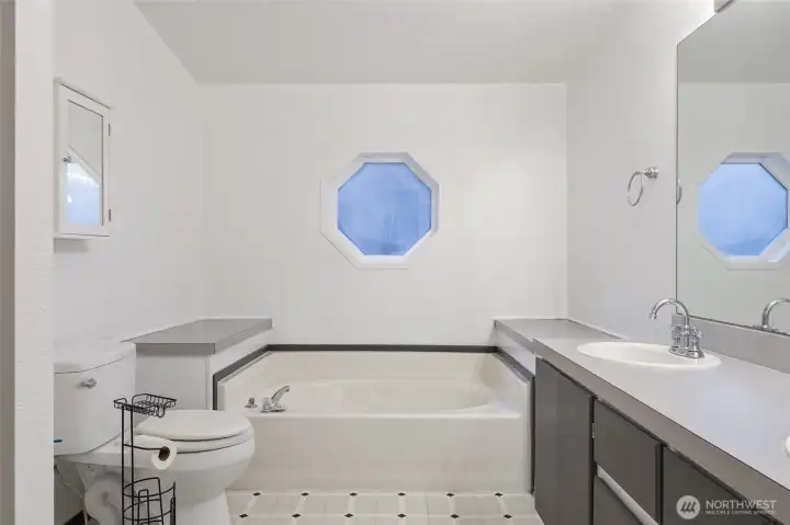 Primary bathroom with double sinks and separate shower.