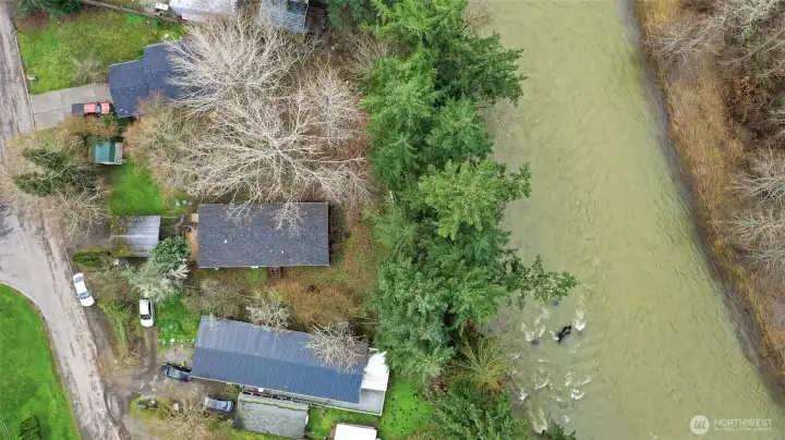 Middle home with high bank lot.