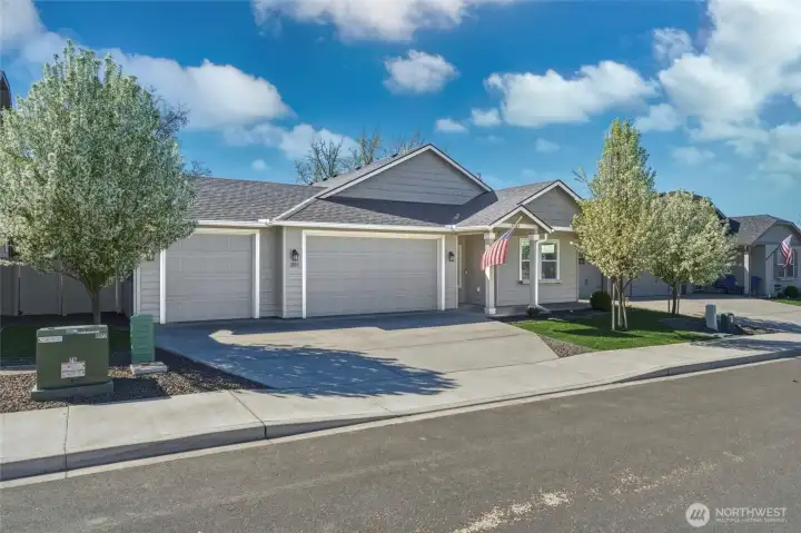 Three-car garage with access to fully-fenced backyard