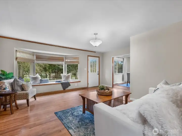 Spacious living room with large bay window