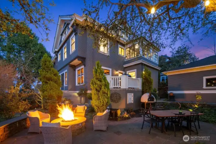 Redesigned the yard with tiered spaces, stone patios and fencing for privacy.