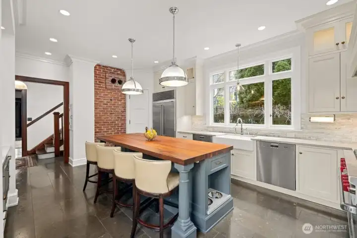 The kitchen was remodeled by combining two rooms and a porch to create a chef inspired kithen.