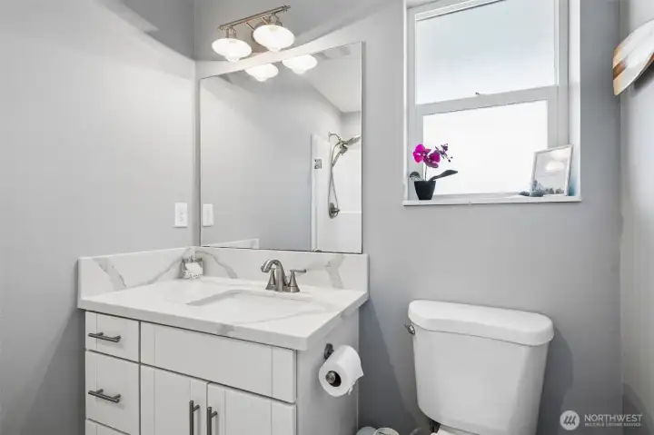 Primary 3/4 bathroom with shower.