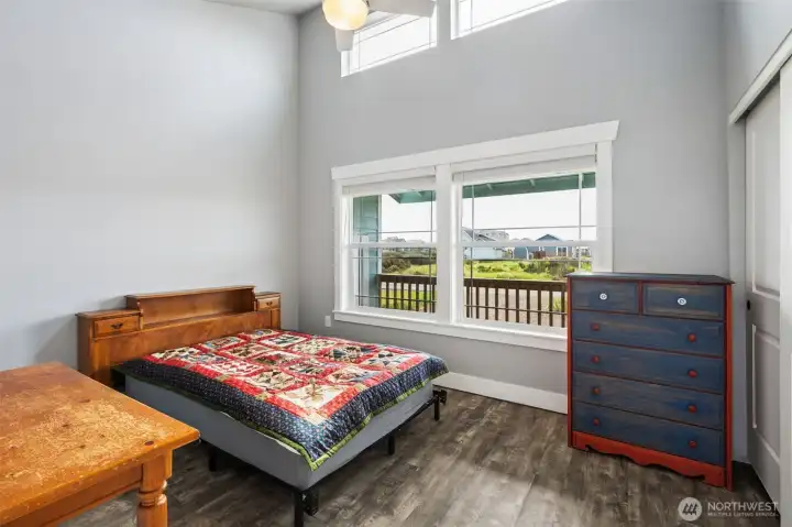 This is the secondary bedroom. It faces the front covered porch & yard.