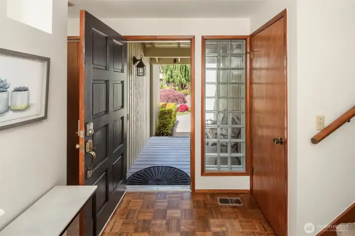 A welcoming foyer with a large coat closet and plenty of room for hugs and kisses and shoes!