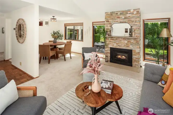 Not shown in this picture are the incredible vaulted ceilings with stunning transom windows. The view into the backyard is lush and private. Everything about this home is warm and wonderful.