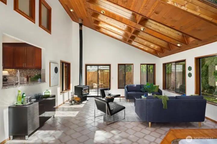 Looking from the sunroom into the kitchen! This home has a lot of WOW factor.