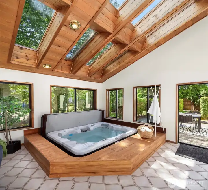 Brand new hot tub with newly built surround! The slider out to the patio is shown here.