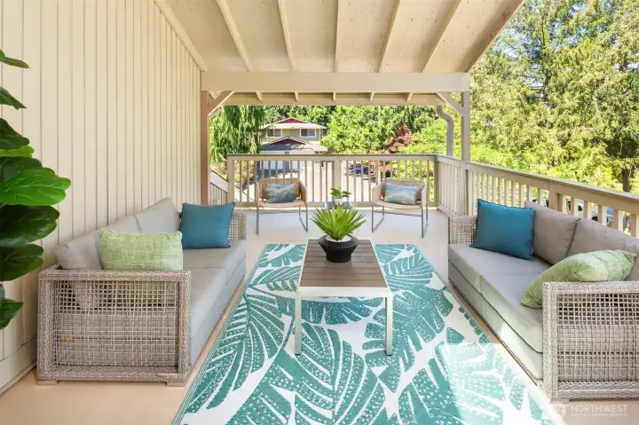 This massive patio is just off the upstairs primary suite and is absolutely perfect for entertaining! Not shown here is the exterior staircase that leads up from the yard. There are a so many places to hang out in this incredible home!