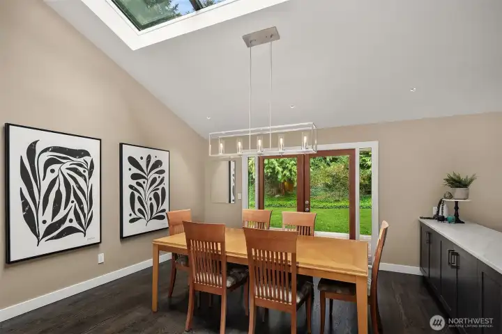 Skylights for natural lighting highlight second dining space in kitchen Skylights for natural lighting highlight second dining space in kitchen