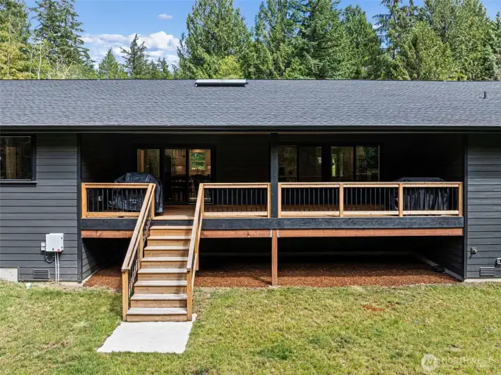 Covered back deck with stairs to the yard