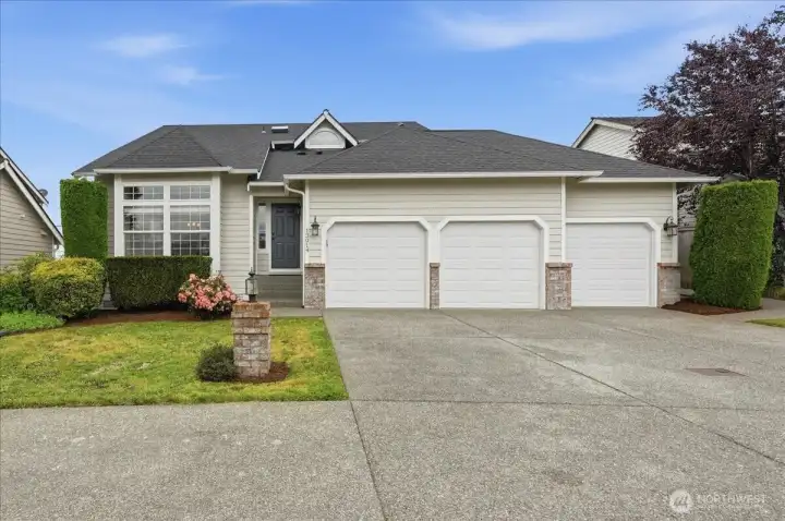 Front of house with 3 car driveway