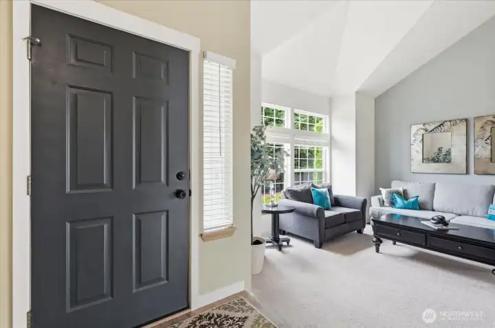 Entryway leads into bright living room