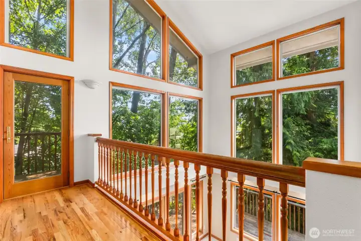 Landing out of Primary overlooking great room and kitchen