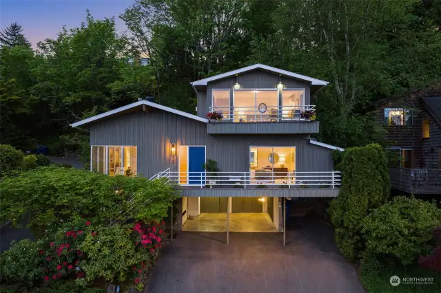 Home sits high on the hillside, with sweeping views of Lake Washington and the Cascade Mountains.