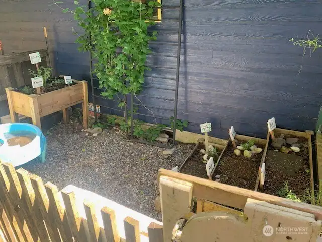 The herb garden on the West side of the house is located just outside the kitchen for easy access.