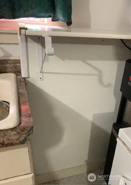 New wall unit with counter has been added in the kitchen of the garage unit.