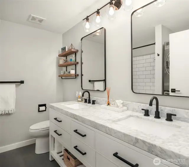 Stylishly remodeled bathroom with plenty of storage.