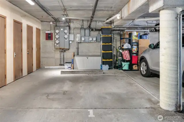 Secure garage with one parking space and storage.