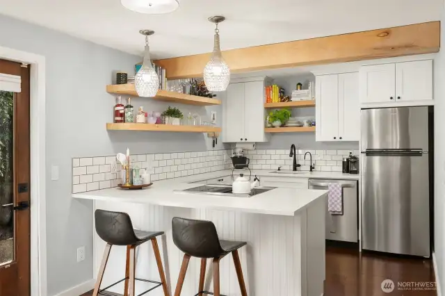 The kitchen was updated with shaker cabinets, quartz countertops and stainless appliances.