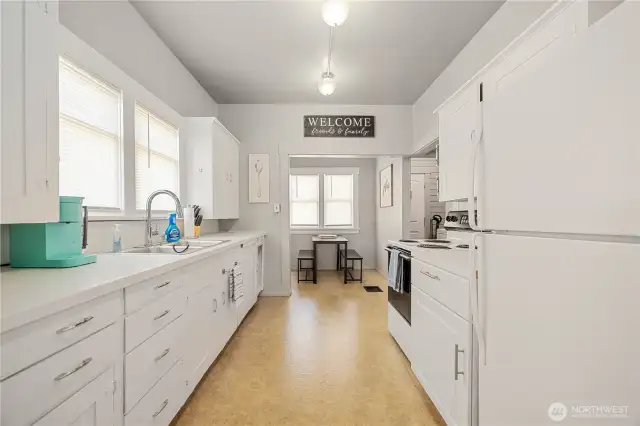 Full Kitchen with Eating nook and Mud Room to back yard.