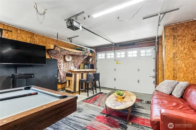 Seller is happy to leave the bar, TV & pool/ping pong table or remove them by closing for it to be used as a traditional garage and shop.