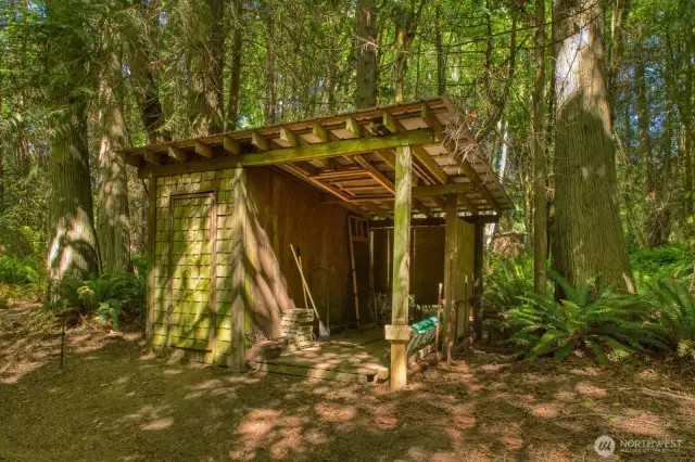 Exterior storage shed & covered area.  Could be converted to sauna?