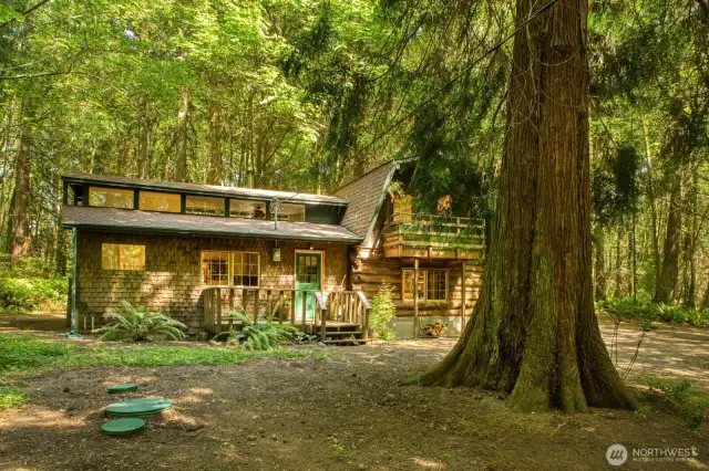 Clerestory windows, deck and lofted upstairs are some of the unique architectural features.