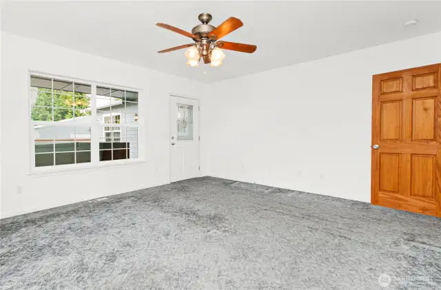 Primary bedroom with outside entrance to large back deck and 6 person hot tub.