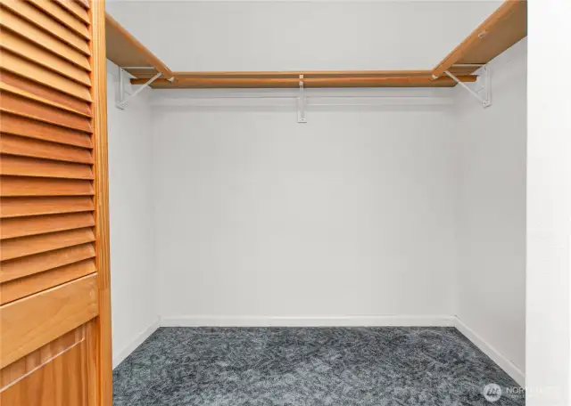Primary bedroom walk-in closet