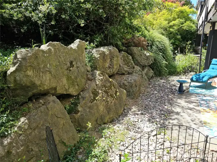 The large rock wall creates a cove of privacy.