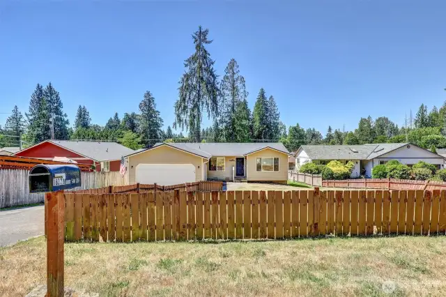 Large, fenced lot and wonderful 1 story home with a new roof.