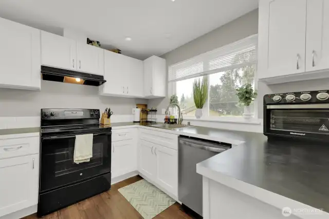 Beautiful white cabinets for ample storage in kitchen.