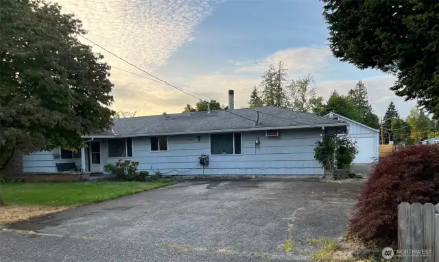 View of Front of the house and driveway from corner of lot.