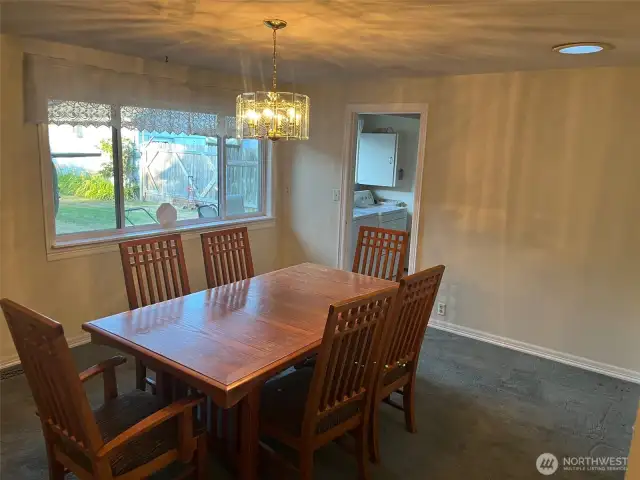 Formal Dining Room looks out to Private fully fenced back yard. Room for China cabinet, buffet and large dining table.