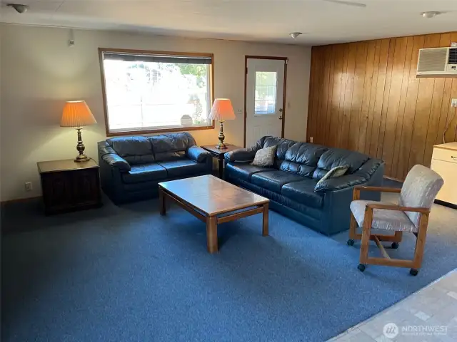 Far corner is side entry to house with steps down to driveway from living room.