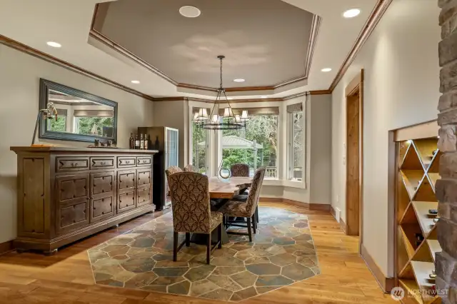 The formal dining room with a slate-inlaid floor and built-in wine storage.
