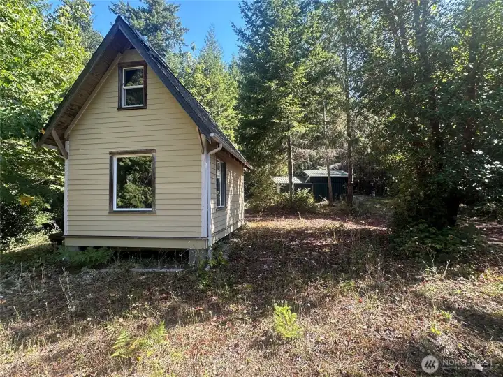 Off-grid tiny home with shop.