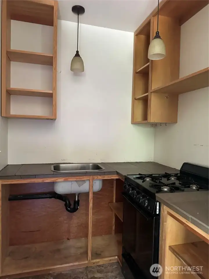 Basic kitchen area with solar light and propane stove.