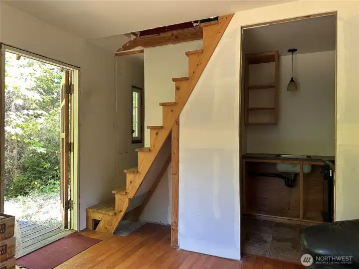 Main floor entry and stairway to upper floor.