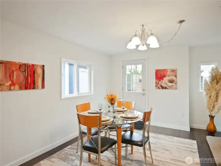 A cozy nook with floral accents and soft lighting—perfect for meals or morning coffee.