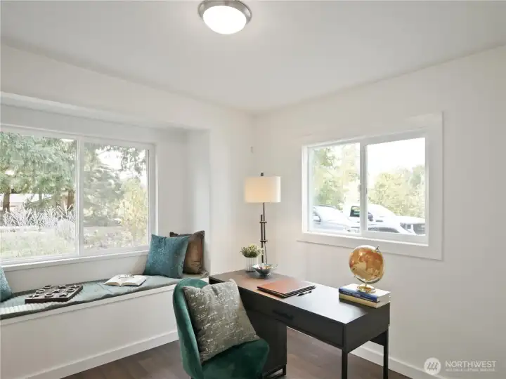 Sunlit workspace with dual windows and a peaceful vibe—your go-to spot for productivity or quiet reflection.