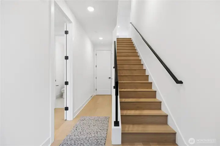 From the front door you will find a bedroom and ensuite on the main floor, garage entry and stairs to the main floor.