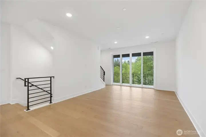 Up the stairs to the main floor you will find ample living space with delightful greenspace views!