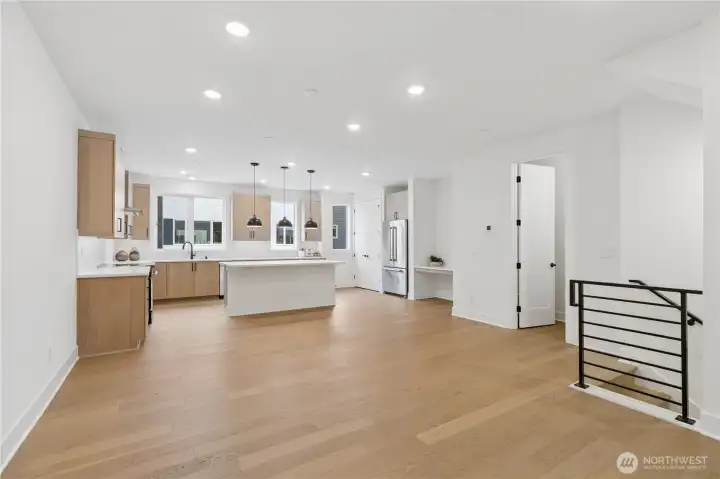 Generous living area, home command center with an expanse of hardwoods!