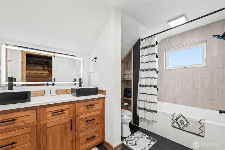 The upstairs bathroom. Gorgeously remodeled!! And a view of Mt. Rainier from the shower!