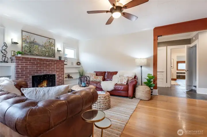 Living room with fireplace and original hardwood floors