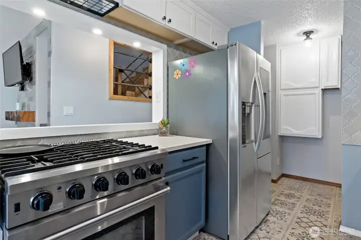 Bright Kitchen Featuring a Premium Gas Range
