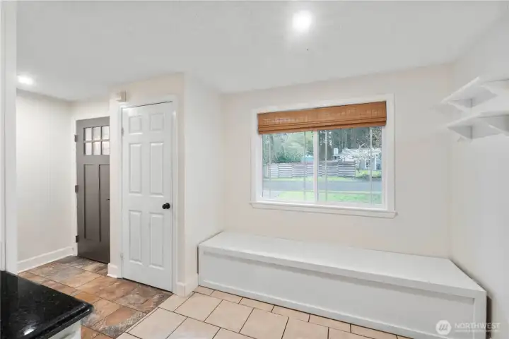 Large entry with a cozy nook off the kitchen. Perfect for your morning cup of coffee.